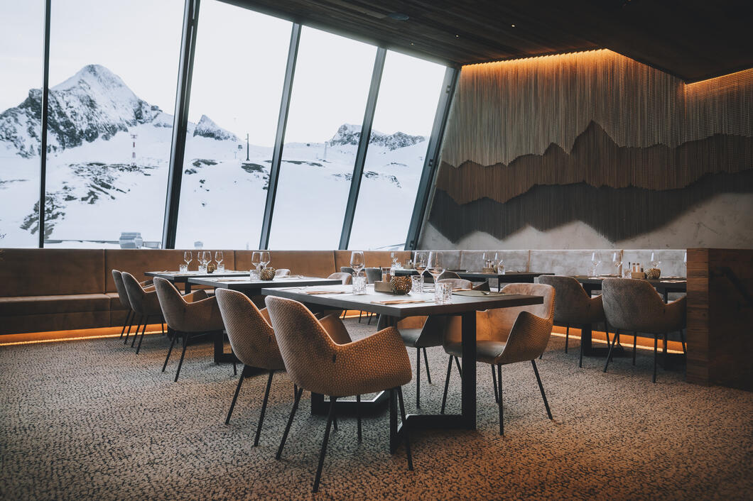 Elegant restaurant with a view of snow-covered mountains