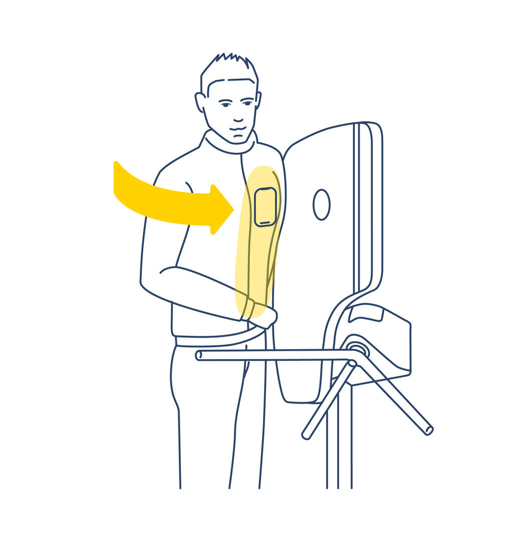 Man passes turnstile with hand in front of reader